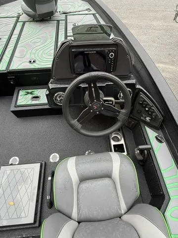 Slide: The Image of 2023 Xpress Boats X19 PRO cockpit with steering wheel and modern dashboard. - 6