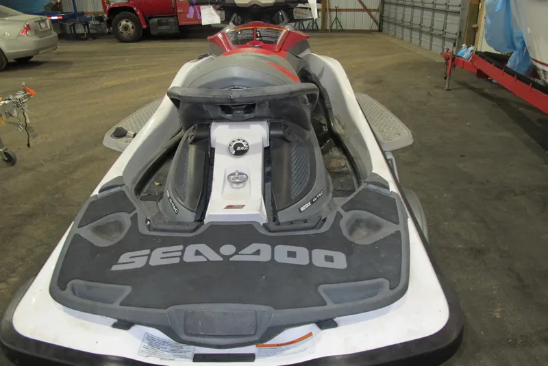 Slide: The Image of 2011 Sea-Doo GTX 155 jet ski in a garage setting. - 3