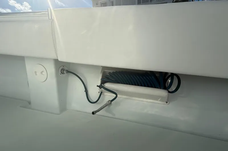 Slide: The Image of Open hatch on 2003 Contender 27 Open boat showing ropes and anchor. - 19