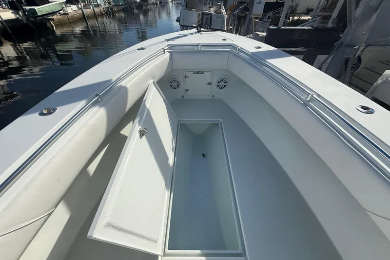 Slide: The Image of Close-up of a 2003 Contender 27 Open boat motor and propeller in water. - 22