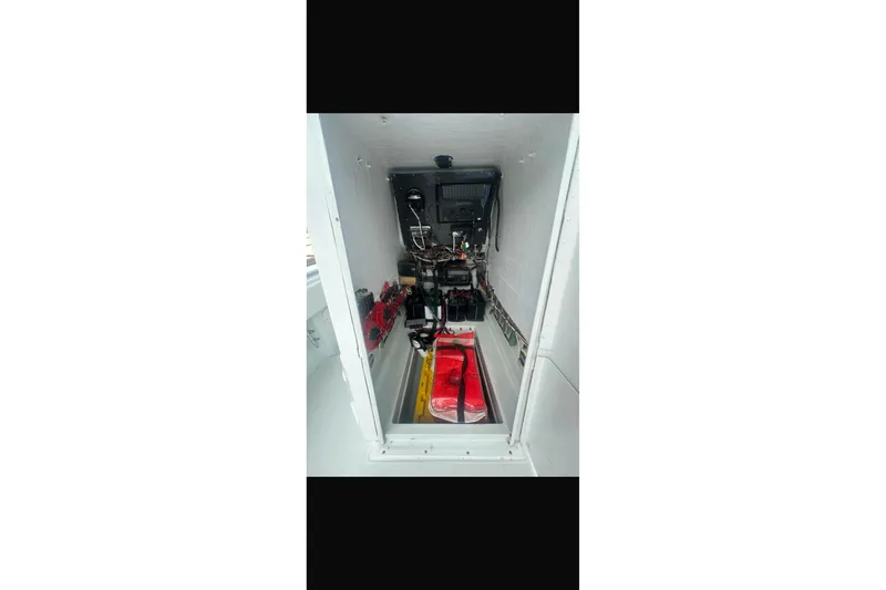 Slide: The Image of Electrical system of a 2003 Contender 27 Open boat, featuring wiring and switches. - 37