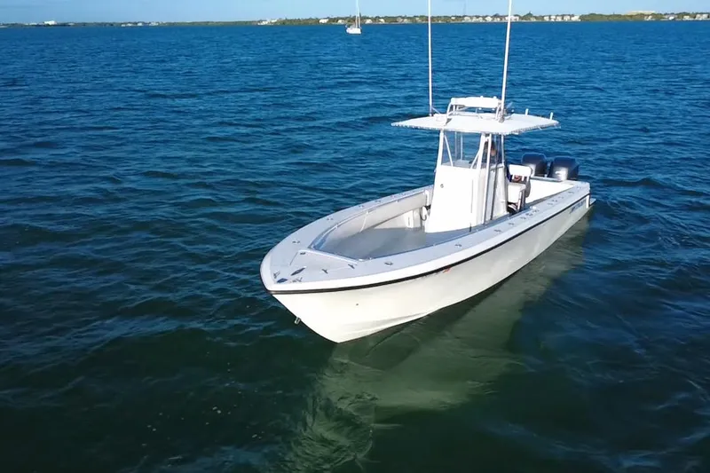 Slide: The Image of Twin Yamaha 250 outboard engines on a 2003 Contender 27 Open boat. - 40