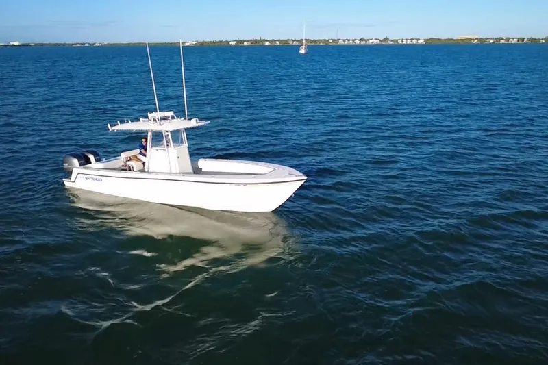 Slide: The Image of Twin Yamaha 250 engines on a 2003 Contender 27 Open boat in motion. - 42