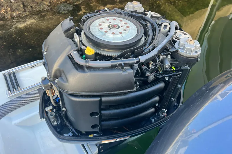 Slide: The Image of Outboard motor of a 2003 Contender 27 Open boat, detailed view. - 54