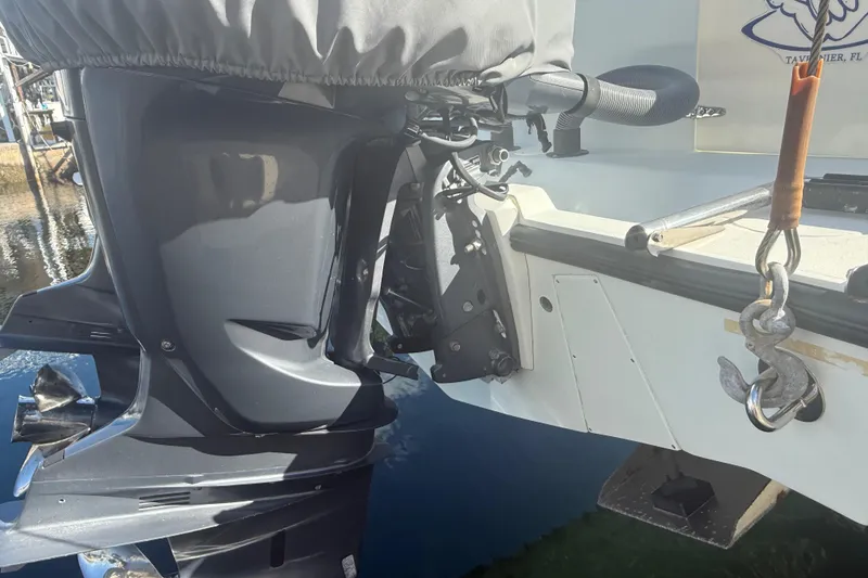 Slide: The Image of 2003 Contender 27 Open boat with dual engines on open water. - 6