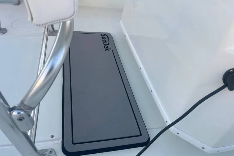 Slide: The Image of 2003 Contender 27 Open boat deck with SeaDek mat and stainless steel railing. - 68