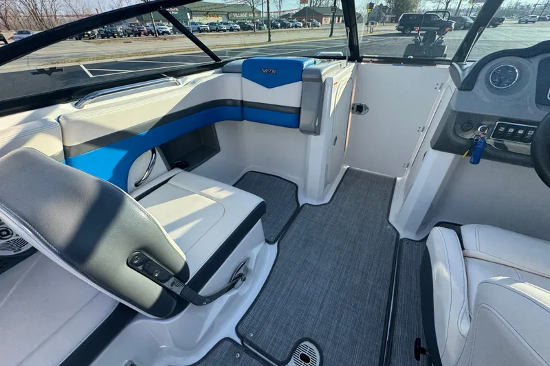 Slide: The Image of 2018 Chaparral Vortex 203 VRX boat interior with seating and dashboard view. - 11