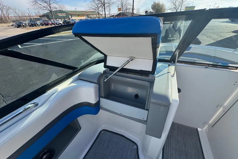 Slide: The Image of 2018 Chaparral Vortex 203 VRX boat interior with open storage compartment. - 12