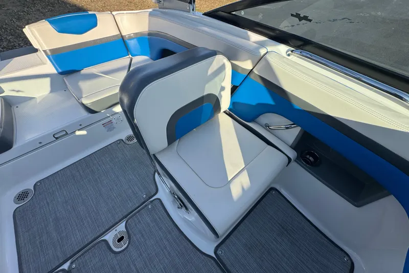Slide: The Image of 2018 Chaparral Vortex 203 VRX boat interior with blue and gray seating. - 14