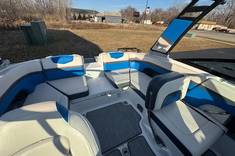 Slide: The Image of 2018 Chaparral Vortex 203 VRX boat interior with blue and white seating. - 15