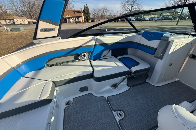 Slide: The Image of 2018 Chaparral Vortex 203 VRX boat interior with blue and gray seating. - 16
