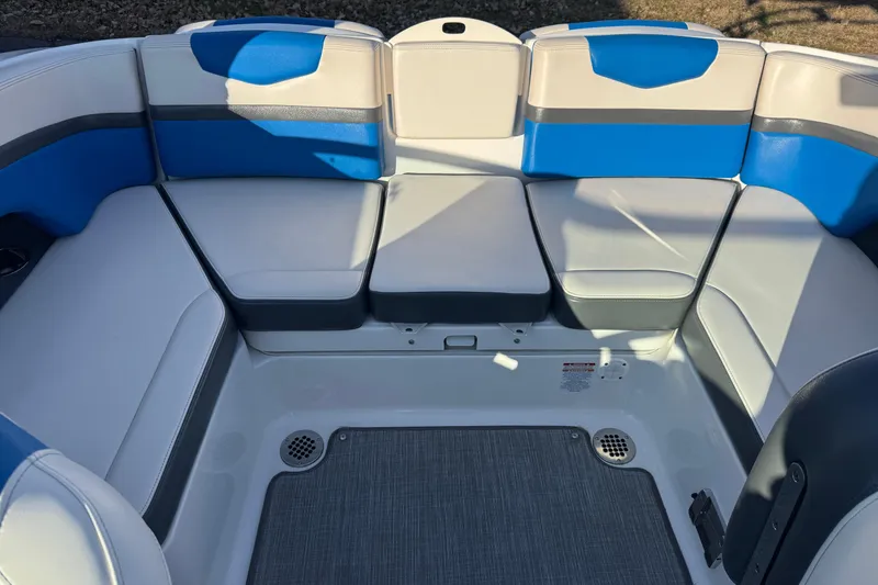 Slide: The Image of 2018 Chaparral Vortex 203 VRX boat interior with blue and gray seating. - 18