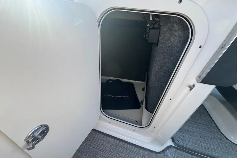 Slide: The Image of Open storage compartment in 2018 Chaparral Vortex 203 VRX boat interior. - 23