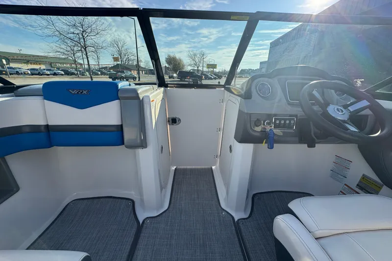 Slide: The Image of 2018 Chaparral Vortex 203 VRX boat interior with steering wheel and seating. - 8