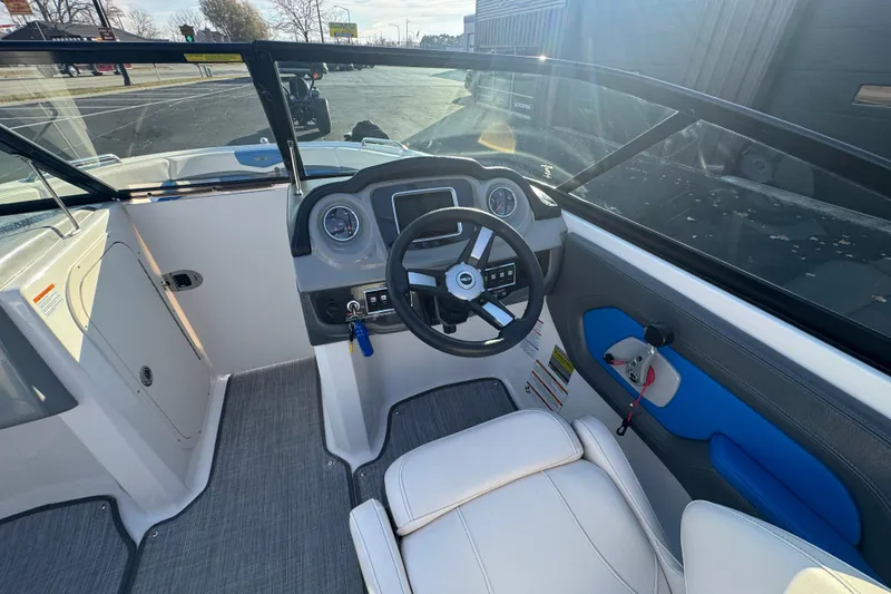 Slide: The Image of 2018 Chaparral Vortex 203 VRX boat interior with steering wheel and dashboard. - 9