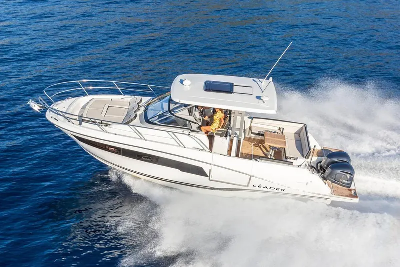 The Image of 2025 Jeanneau Leader 10.5 WA Series 2 boat displayed in a marina setting. - 0