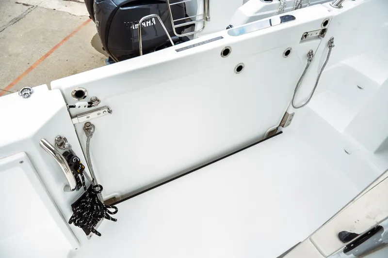 Slide: The Image of 2025 Jeanneau Leader 10.5 WA Series 2 boat seating area with white cushions. - 12