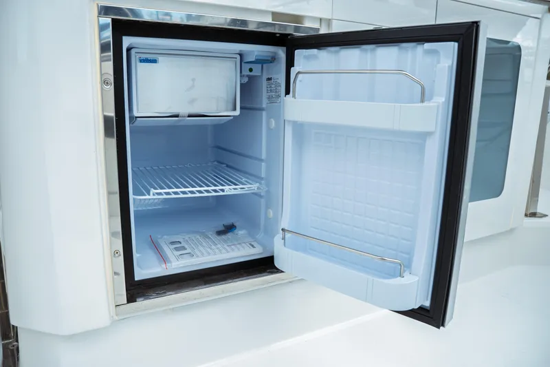 Slide: The Image of 2025 Jeanneau Leader 10.5 WA Series 2 boat kitchen with grill and sink. - 16