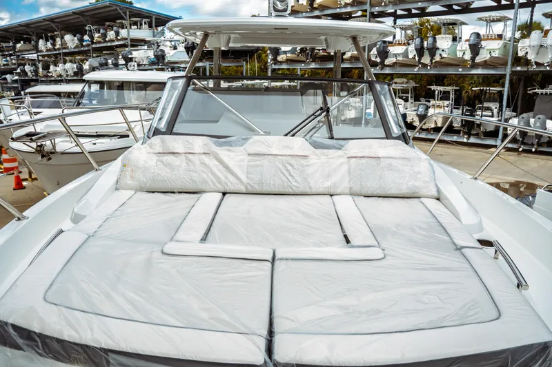 Slide: The Image of 2025 Jeanneau Leader 10.5 WA Series 2 boat, docked with sleek design and modern features. - 22