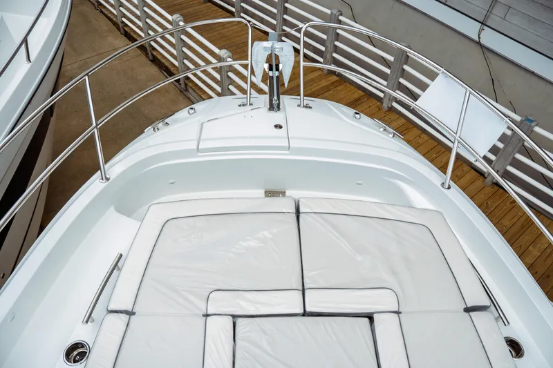 Slide: The Image of 2025 Jeanneau Leader 10.5 WA Series 2 boat with cushioned deck seating. - 24