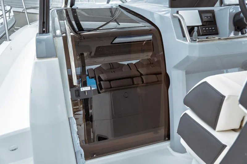 Slide: The Image of 2025 Jeanneau Leader 10.5 WA Series 2 boat deck with cushioned seating and railing. - 25