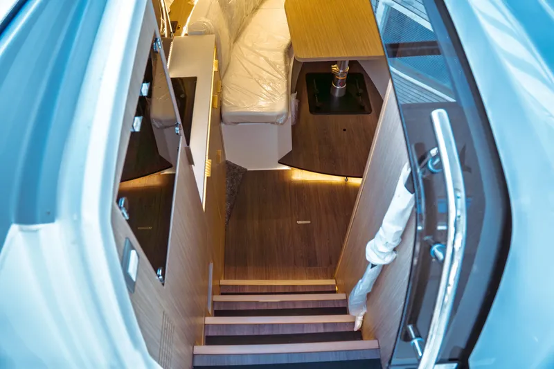 Slide: The Image of 2025 Jeanneau Leader 10.5 WA Series 2 cabin entrance with sleek interior design. - 26