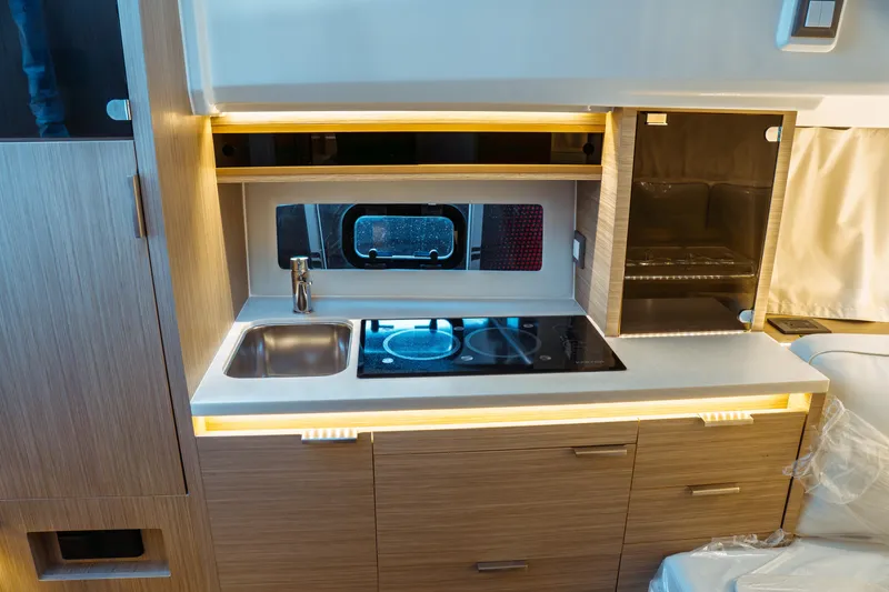 Slide: The Image of Modern kitchen in 2025 Jeanneau Leader 10.5 WA Series 2 boat, featuring sleek design and appliances. - 29