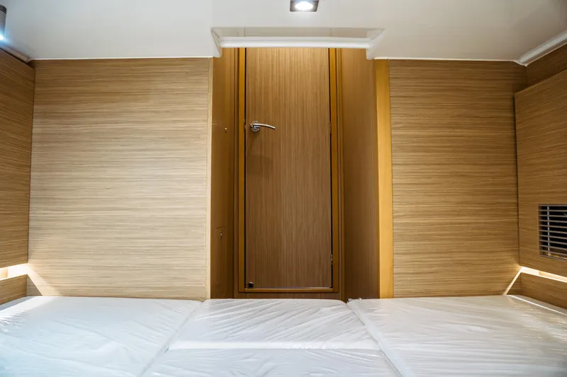 Slide: The Image of Interior of 2025 Jeanneau Leader 10.5 WA Series 2, featuring modern wood paneling and lighting. - 39