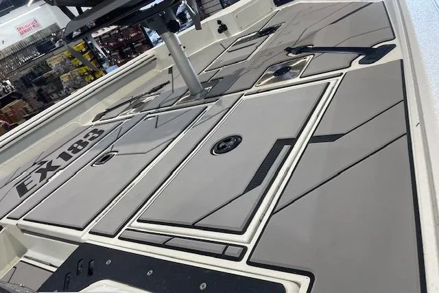 Slide: The Image of 2026 Excel 183C boat deck with sleek design and storage compartments. - 10