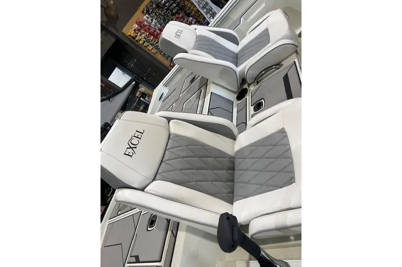 Slide: The Image of 2026 Excel 183C boat seats with gray and white diamond pattern upholstery. - 5