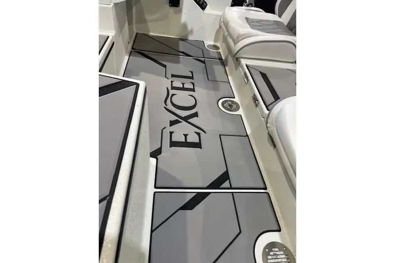 Slide: The Image of 2026 Excel 183C boat interior with sleek gray flooring and modern design. - 7
