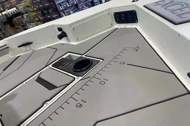 Slide: The Image of 2026 Excel 183C boat deck with integrated ruler and storage compartments. - 9