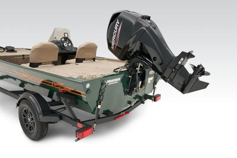 Slide: The Image of 2025 Tracker Bass Tracker Classic Limited boat with Mercury outboard motor, rear view. - 8