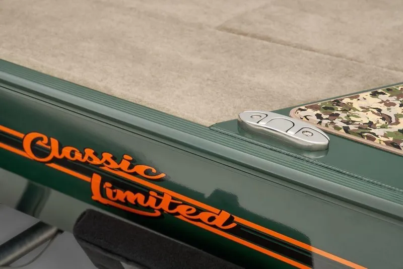 Slide: The Image of 2025 Tracker Bass Tracker Classic Limited boat detail with camo pattern and "Classic Limited" text. - 9