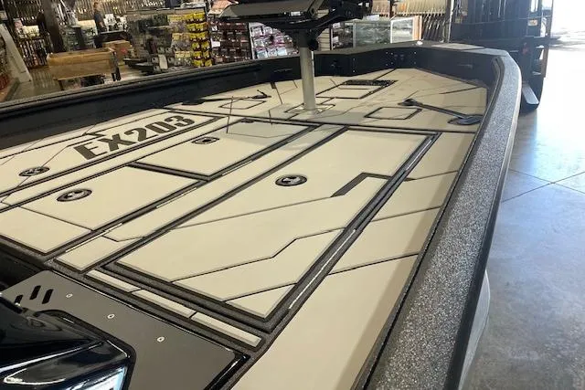 Slide: The Image of 2026 Excel EX203 boat deck with storage compartments in showroom. - 10