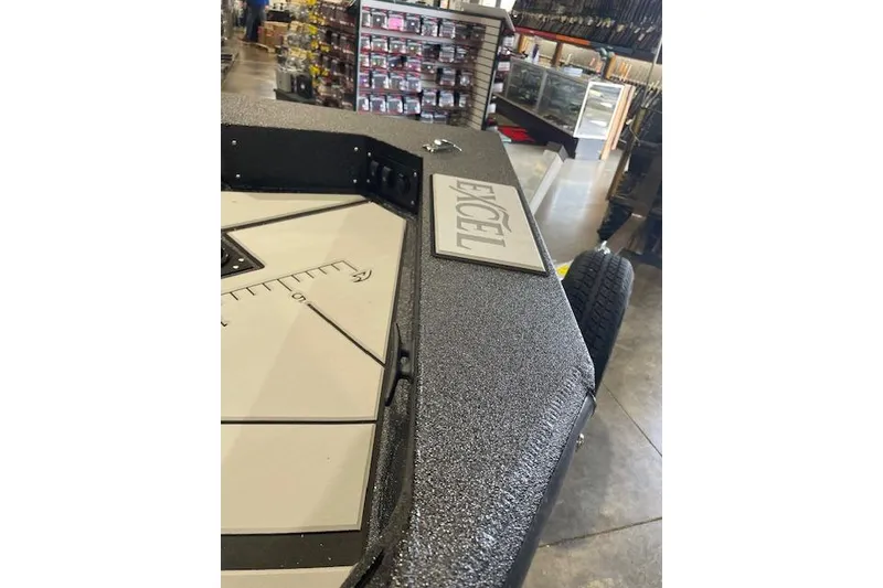 Slide: The Image of Excel EX203 boat interior with textured surface, displayed in a showroom, 2026 model. - 8