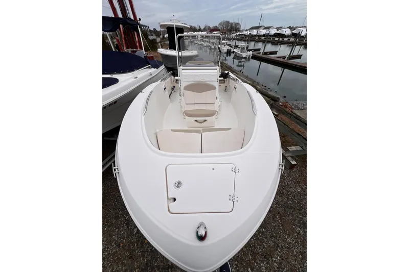 Slide: The Image of 2017 Robalo R180 Center Console boat docked at marina. - 2