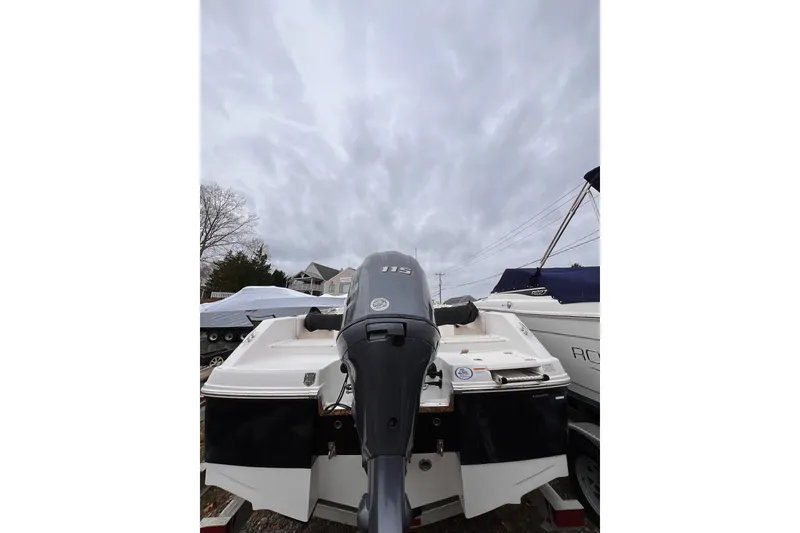 Slide: The Image of 2017 Robalo R180 Center Console boat with outboard motor, under cloudy sky. - 3