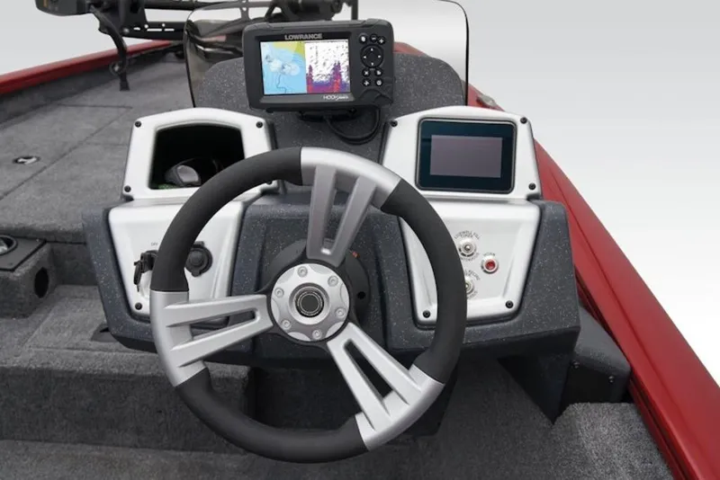 Slide: The Image of 2026 Tracker Pro Team 175 TXW boat dashboard with steering wheel and electronic displays. - 14