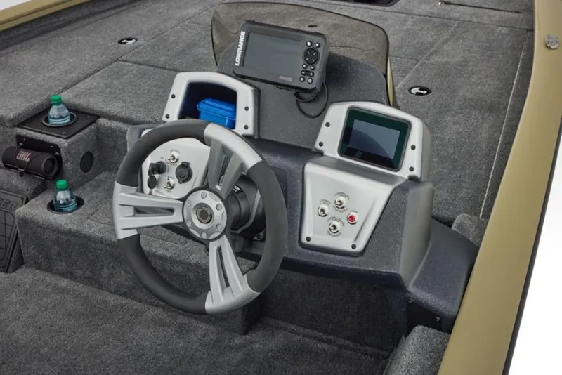 Slide: The Image of 2026 Tracker Pro Team 195 boat dashboard with steering wheel and electronic displays. - 10