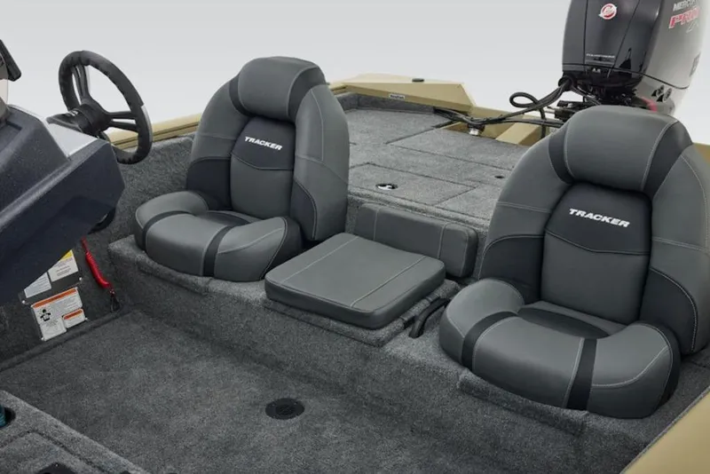 Slide: The Image of 2026 Tracker Pro Team 195 boat interior with gray seating and steering wheel. - 11