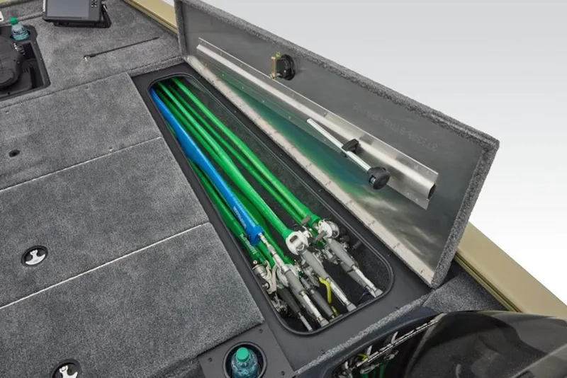 Slide: The Image of 2026 Tracker Pro Team 195 boat with open storage compartment for fishing rods. - 12