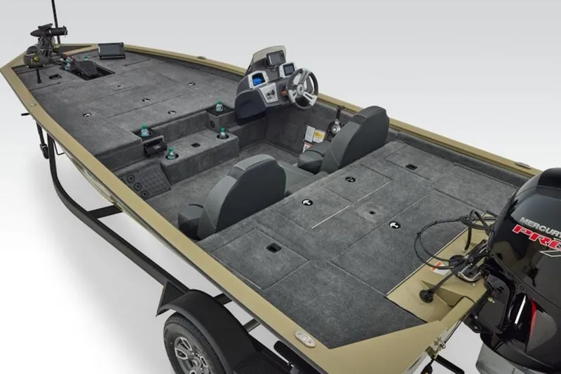Slide: The Image of 2026 Tracker Pro Team 195 fishing boat interior with seating and Mercury engine. - 2