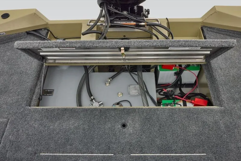 Slide: The Image of 2026 Tracker Pro Team 195 boat battery compartment with wiring and components. - 8