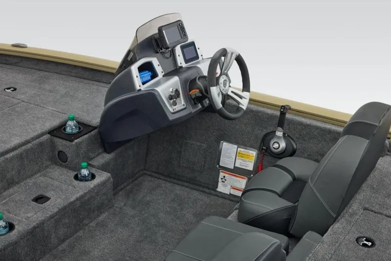 Slide: The Image of 2026 Tracker Pro Team 195 boat interior with steering console and seating. - 9