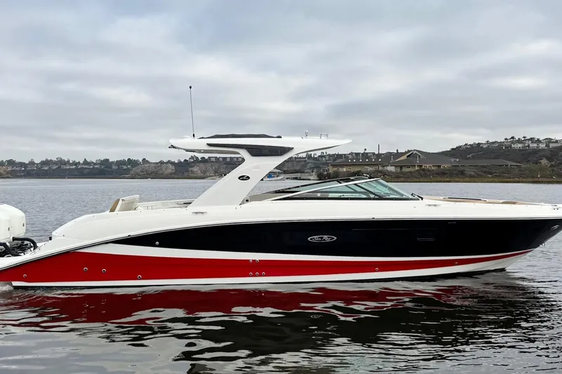The Image of 2023 Sea Ray SLX 350 boat on calm water, overcast sky background. - 0