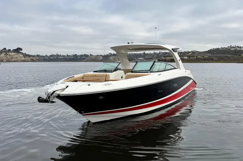 Slide: The Image of 2023 Sea Ray SLX 350 boat on calm water, featuring sleek design and modern amenities. - 5