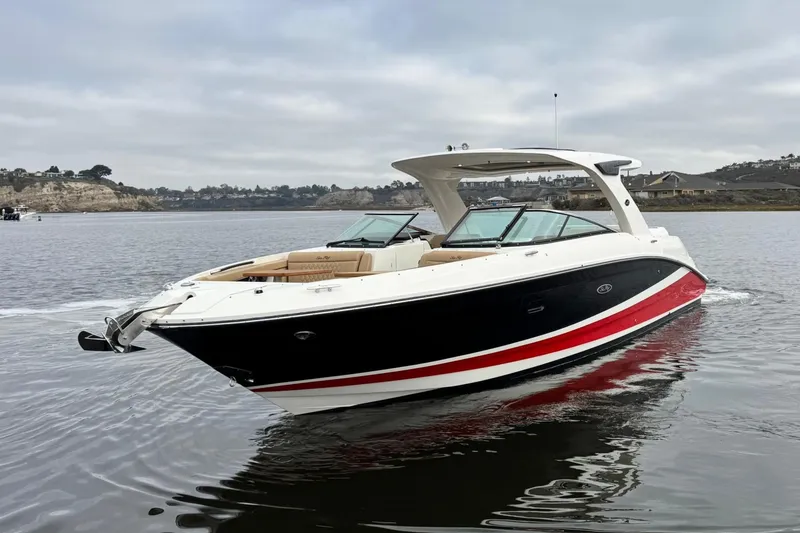 Slide: The Image of 2023 Sea Ray SLX 350 boat on calm water, showcasing sleek design and luxury features. - 6