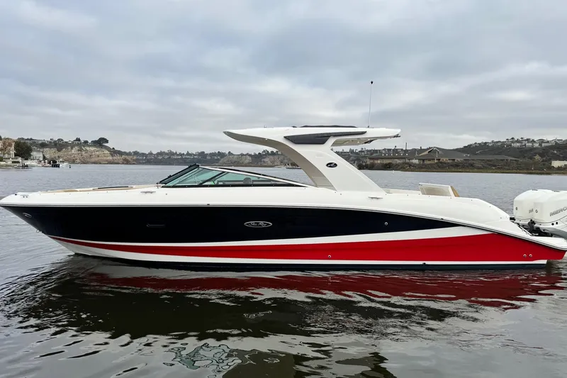 Slide: The Image of 2023 Sea Ray SLX 350 boat on calm water, showcasing sleek design and luxury features. - 7
