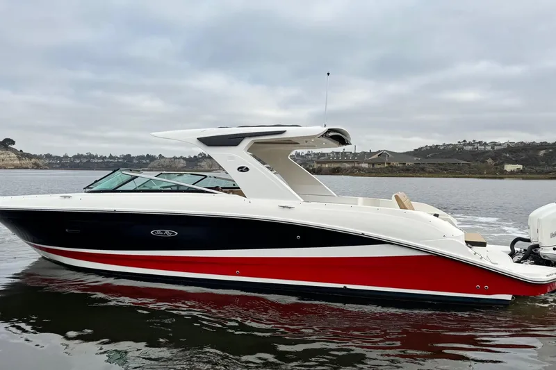 Slide: The Image of 2023 Sea Ray SLX 350 boat on calm water, featuring sleek design and modern amenities. - 8
